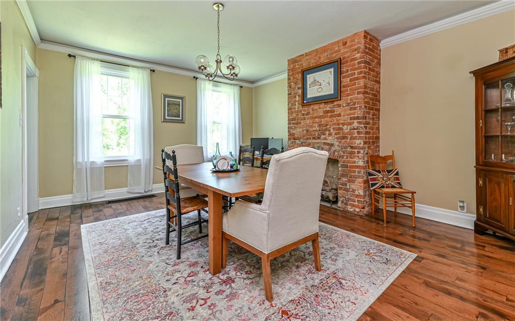 475 Amsler Ridge Road Sewickley, PA 15143 - Photo 11 of 31 a dining room with furniture a rug and wooden floor