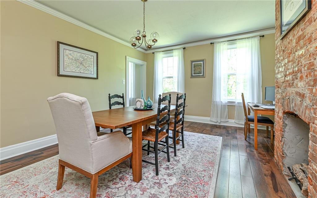475 Amsler Ridge Road Sewickley, PA 15143 - Photo 14 of 31 a dining room with furniture a chandelier and wooden floor