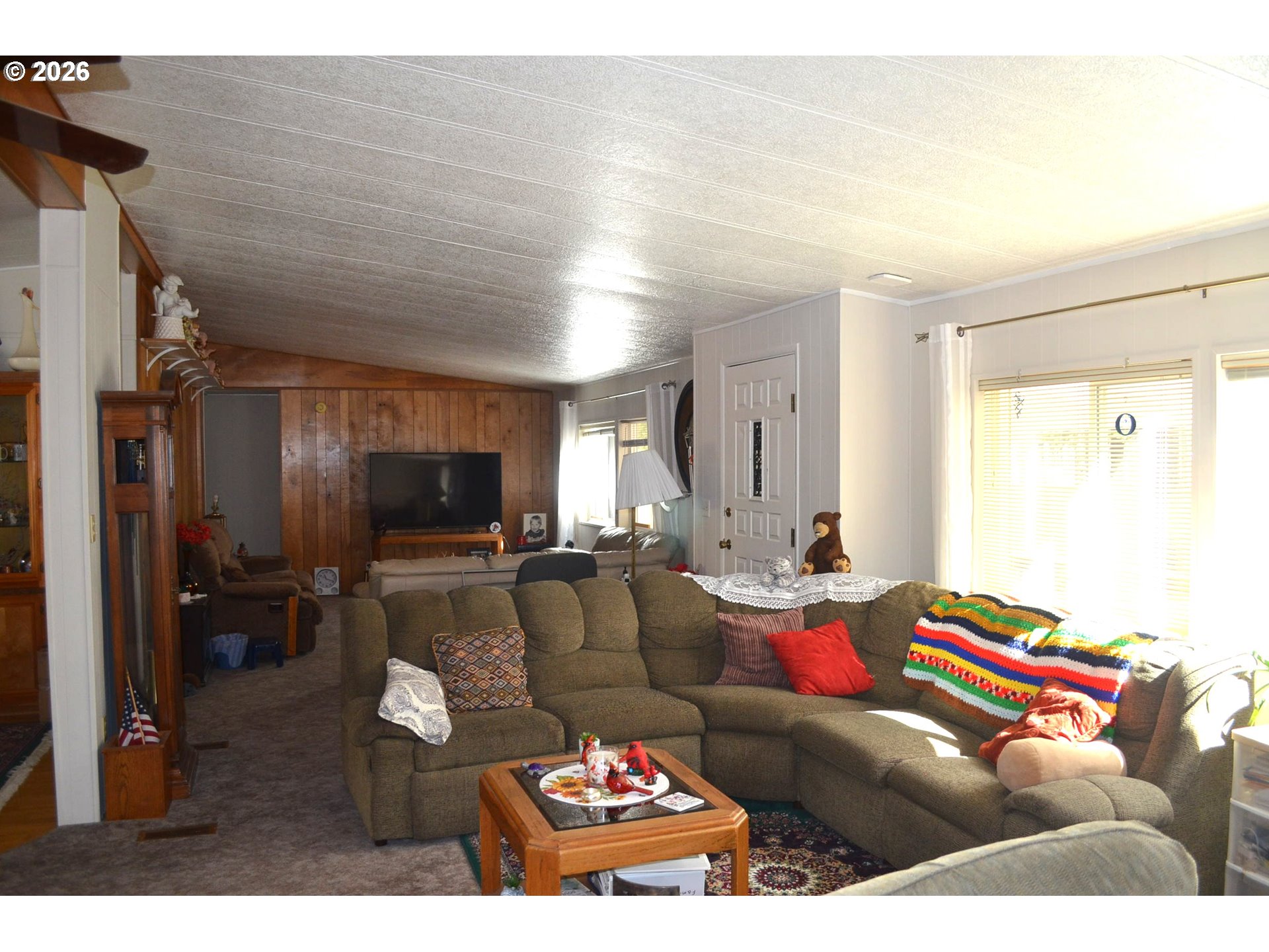 244 Kaehn Road Crescent, OR 97733 - Photo 18 of 47 a living room with furniture and a flat screen tv