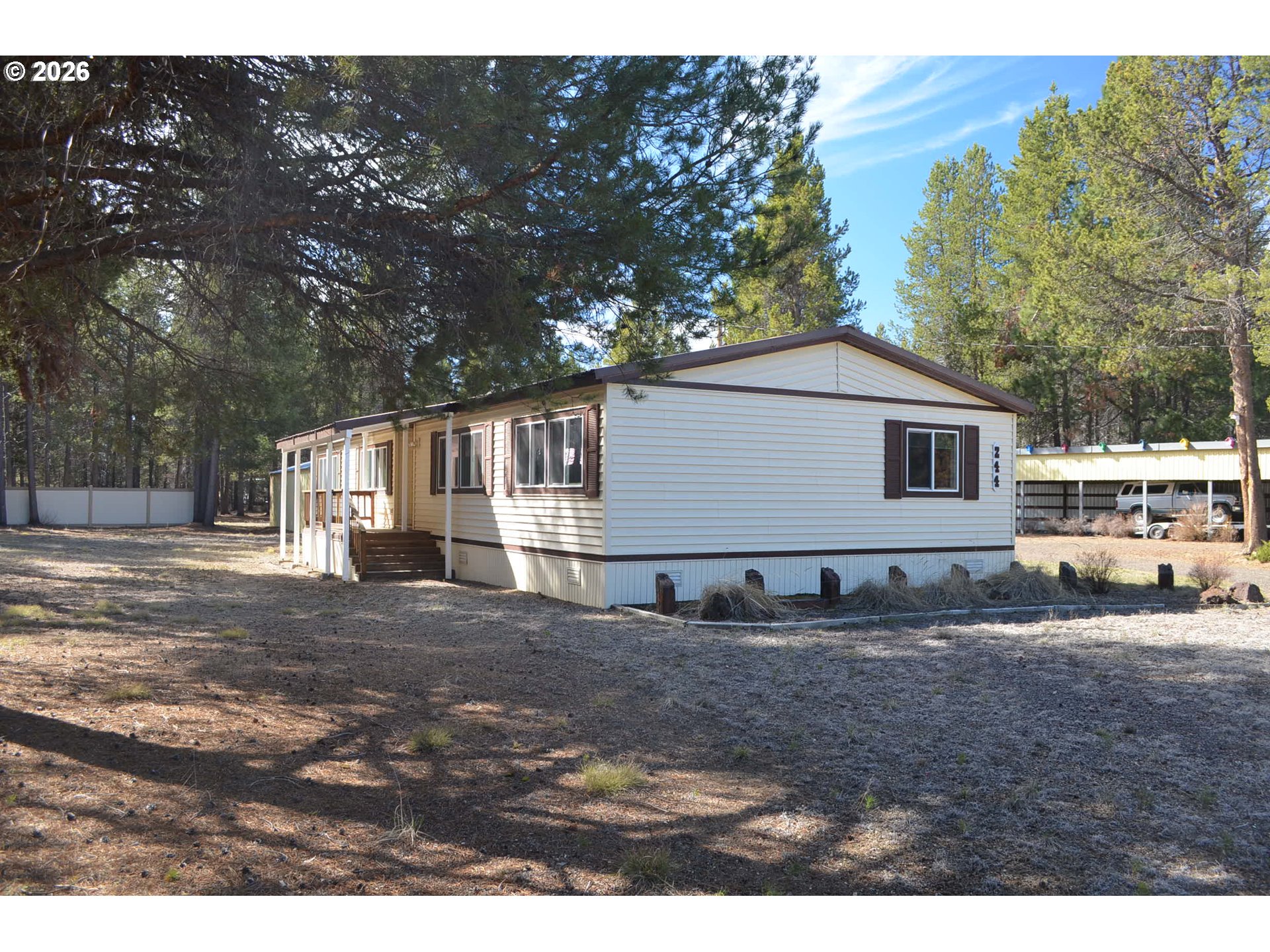 244 Kaehn Road Crescent, OR 97733 - Photo 27 of 47 a view of a yard with a house and a tree