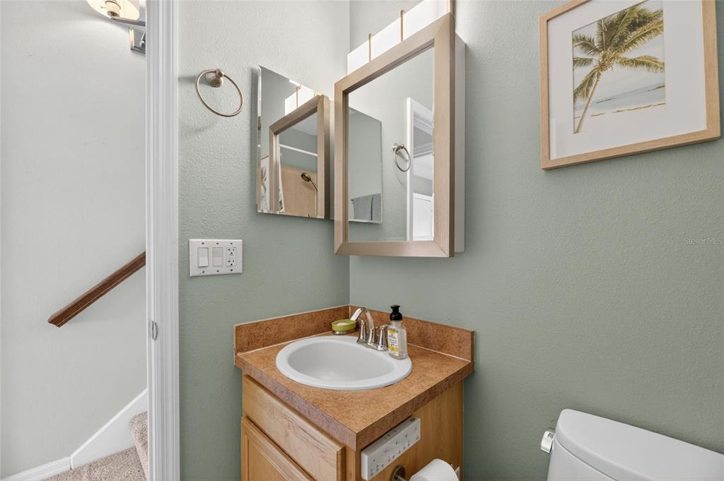 508 Islebay Drive Apollo Beach, FL 33572 - Photo 61 of 98 a bathroom with a toilet sink and mirror
