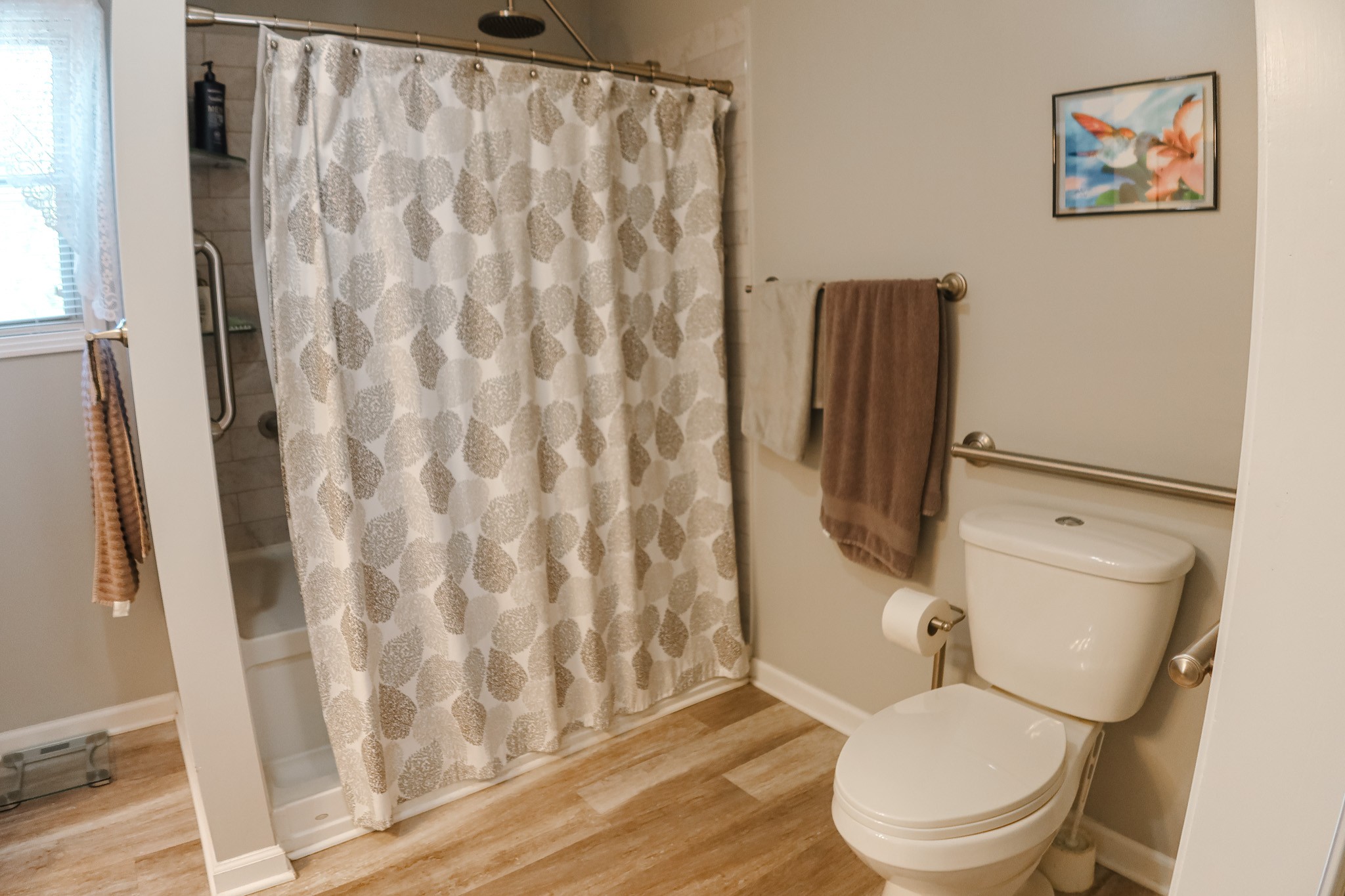 305 Highway 49 Tennessee Ridge, TN 37178 - Photo 19 of 32 a white toilet sitting next to a shower curtain