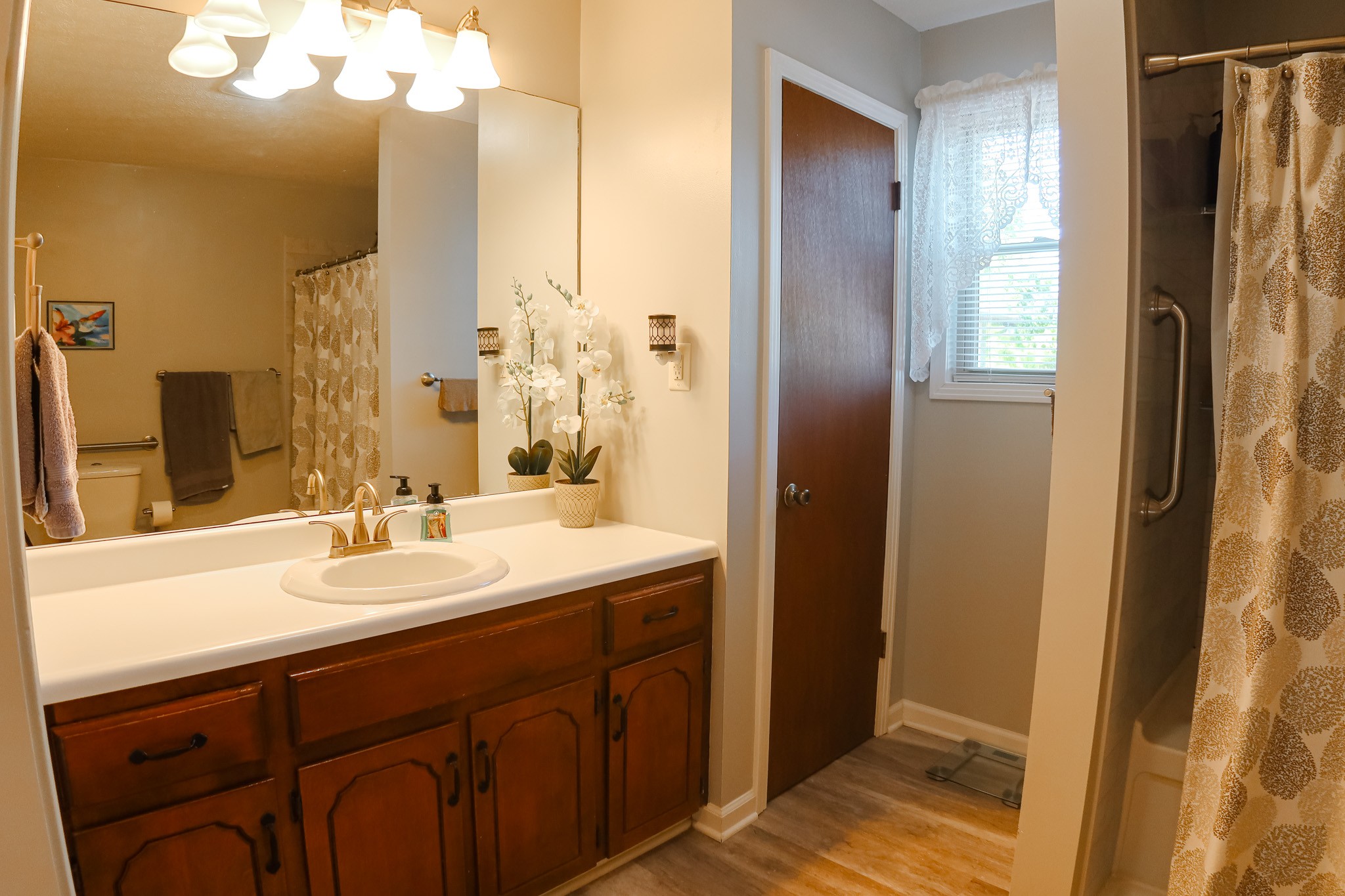 305 Highway 49 Tennessee Ridge, TN 37178 - Photo 20 of 32 a bathroom with a double vanity sink and mirror