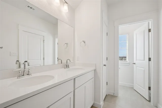 a bathroom with a shower sink and mirror