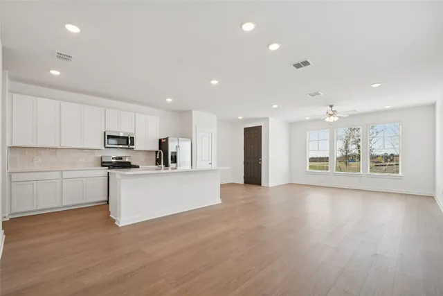 a view of house with wooden fence