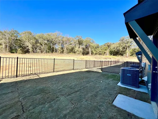 a view of a livingroom with a ceiling fan and window