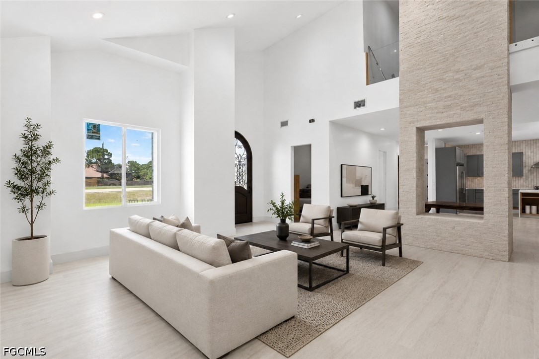 2665 Oil Well Road Naples, FL 34120 - Photo 10 of 40 a living room with furniture and a large window