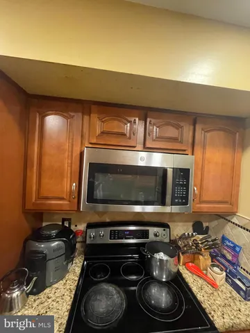 a kitchen with a stove and a microwave