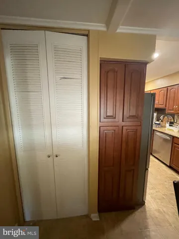 a view of a kitchen from the hallway