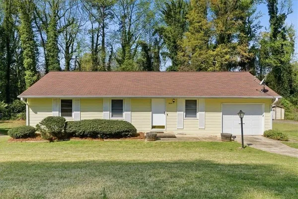 a front view of a house with a yard