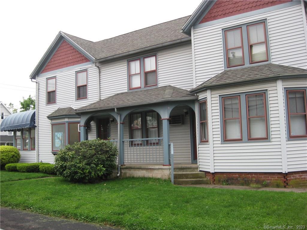 4 Orchard Street Manchester, CT 06040 - Photo 1 of 1 a front view of a house with a garden