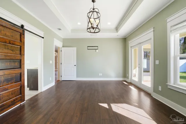 a view of an entryway with wooden floor