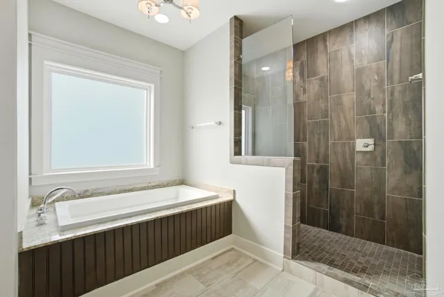 a bathroom with a bathtub and a shower