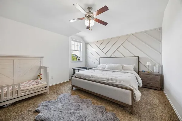 a bedroom with a bed and window