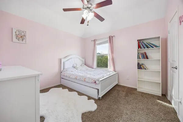 a room with a bed and a chandelier