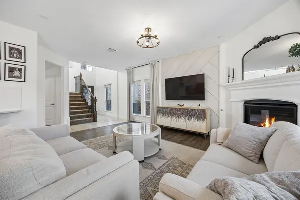 a living room with furniture and a flat screen tv