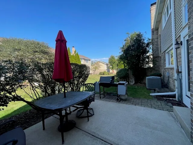a view of a grassy field with trees