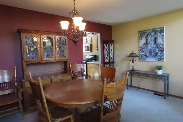 a dining room with furniture and window