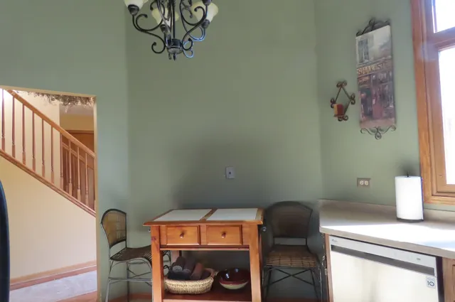 a bathroom with a sink mirror and toilet