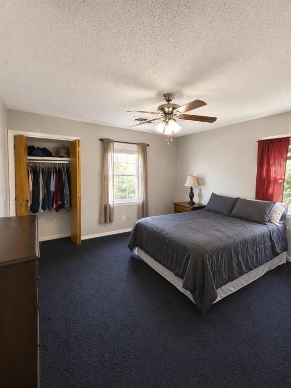 504 Aspen Road Gainesville, TX 76240 - Photo 8 of 11 a spacious bedroom with a bed and window