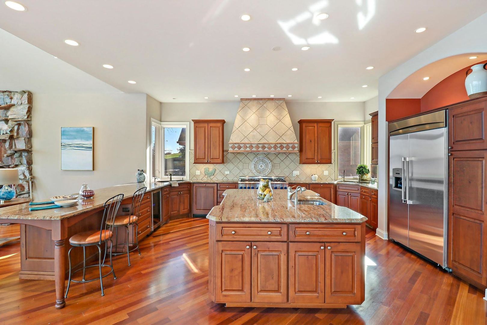 1004 Pistakee View Drive Johnsburg, IL 60051 - Photo 16 of 74 a kitchen with stainless steel appliances granite countertop a sink and a refrigerator