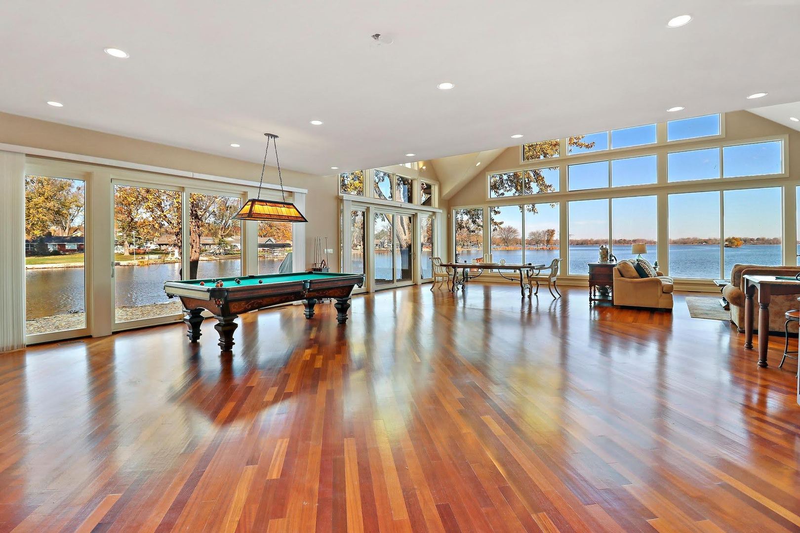 1004 Pistakee View Drive Johnsburg, IL 60051 - Photo 19 of 74 a hallway with wooden floor and dining table with wooden floor
