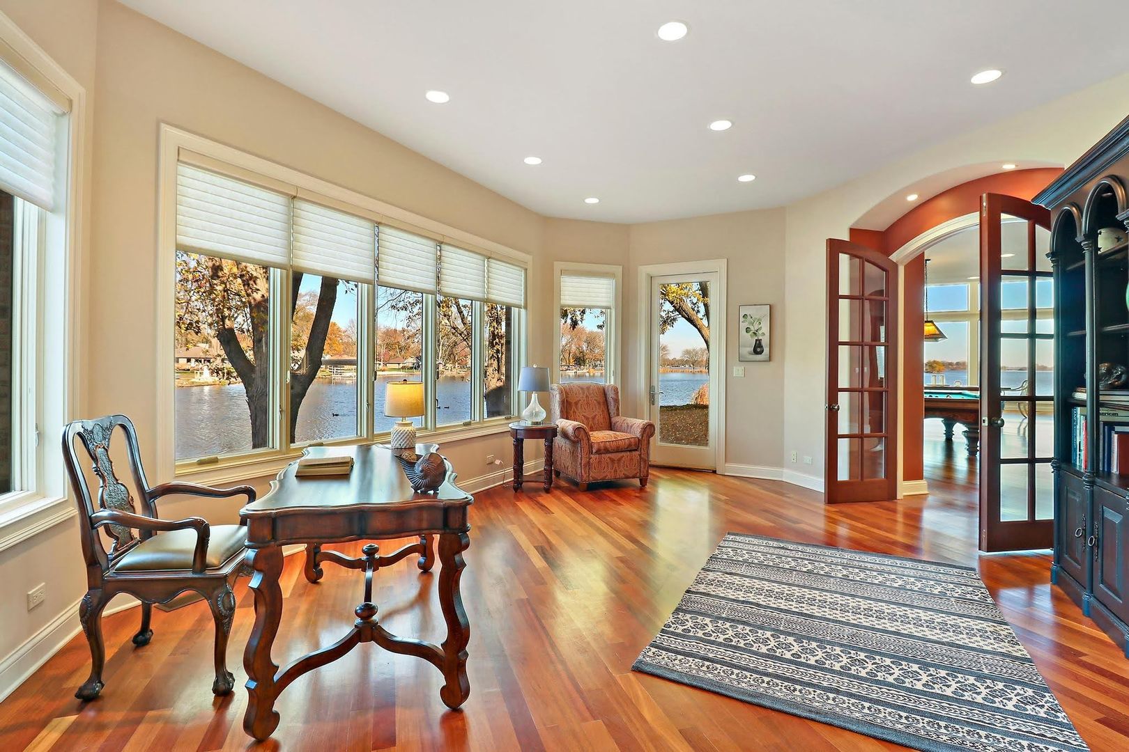1004 Pistakee View Drive Johnsburg, IL 60051 - Photo 22 of 74 a living room with furniture and a floor to ceiling window