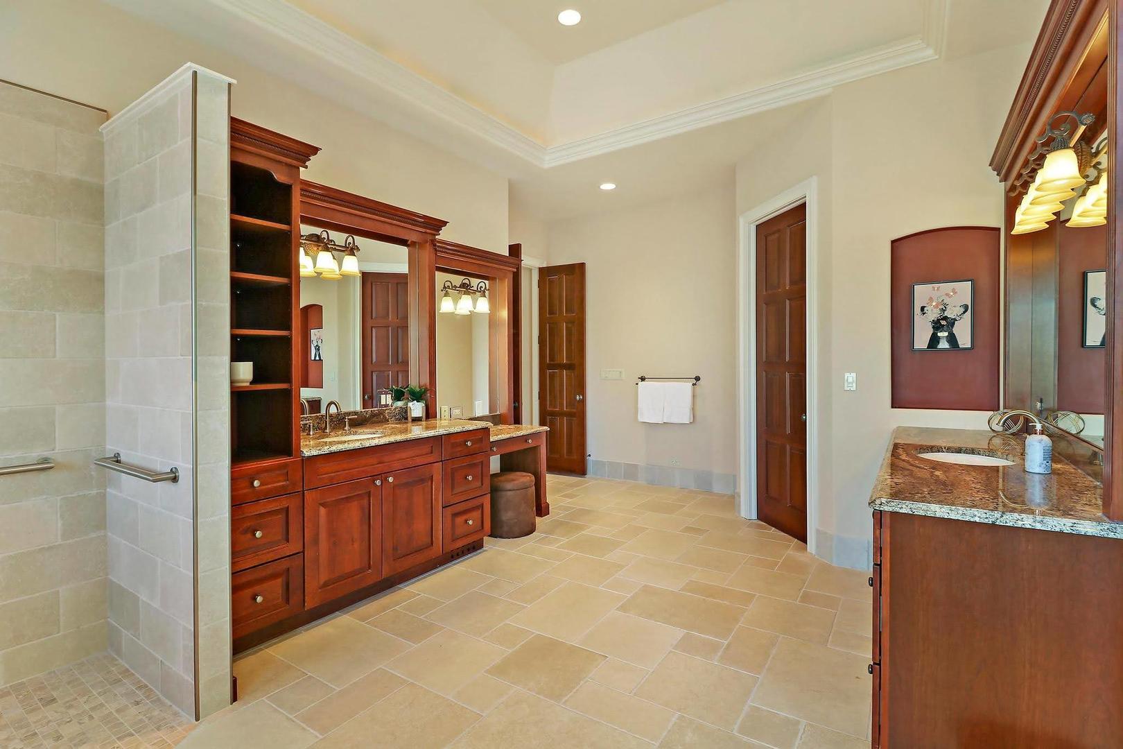 1004 Pistakee View Drive Johnsburg, IL 60051 - Photo 29 of 74 a large bathroom with a granite countertop tub sink and mirror