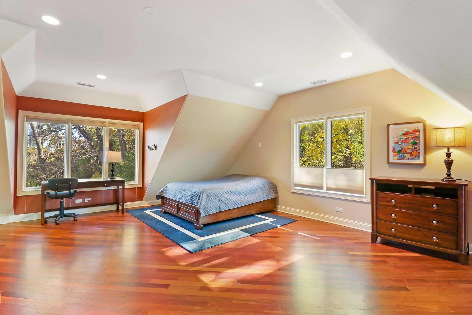 1004 Pistakee View Drive Johnsburg, IL 60051 - Photo 35 of 74 a bedroom with a bed and wooden floor