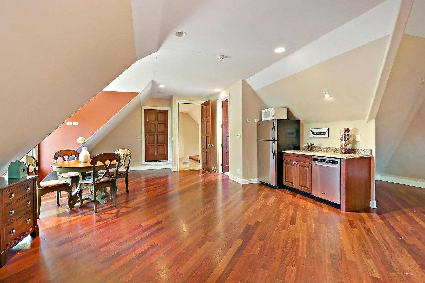 1004 Pistakee View Drive Johnsburg, IL 60051 - Photo 36 of 74 a living room with stainless steel appliances kitchen island wooden floor and view living room