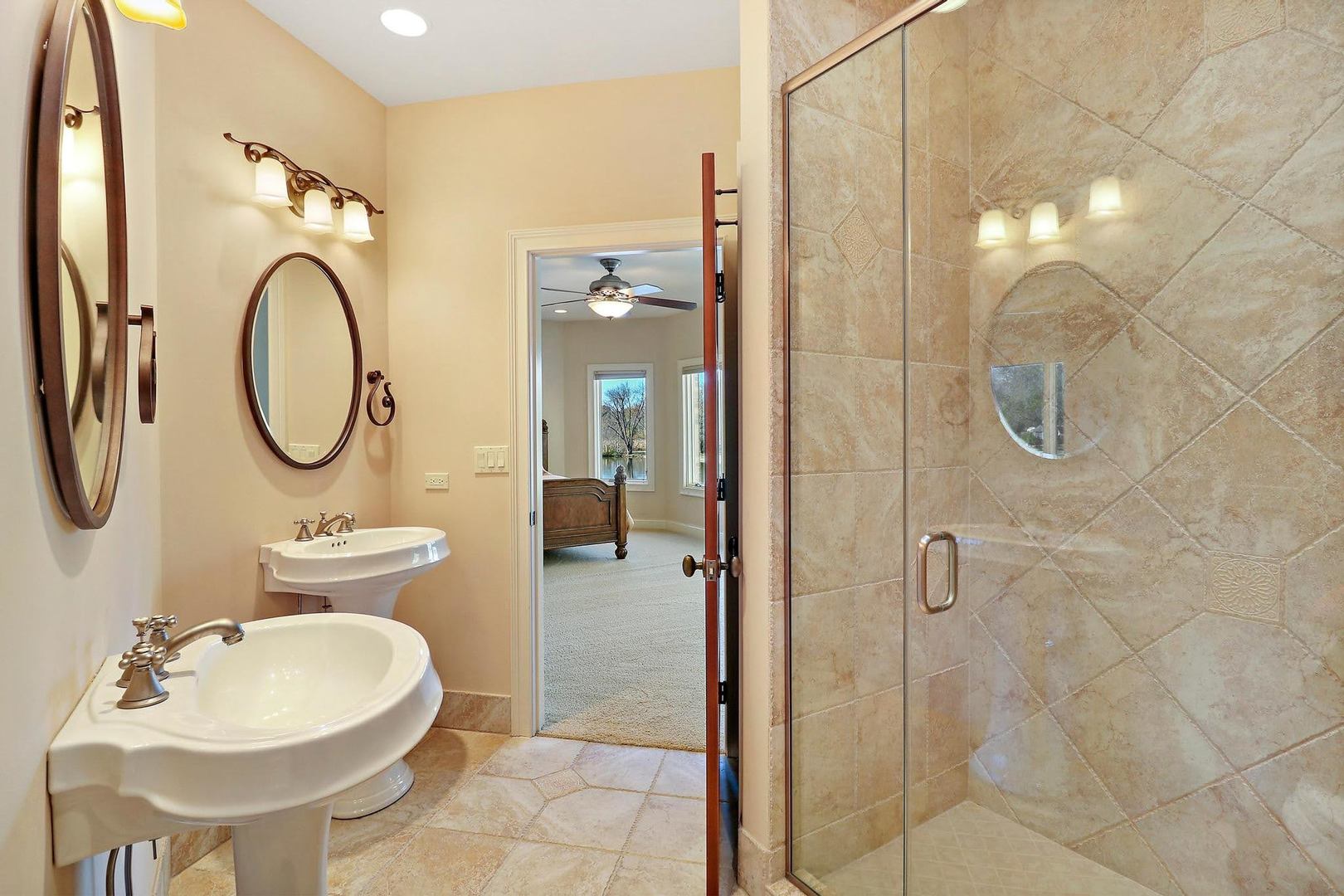 1004 Pistakee View Drive Johnsburg, IL 60051 - Photo 40 of 74 a bathroom with a sink a toilet and shower