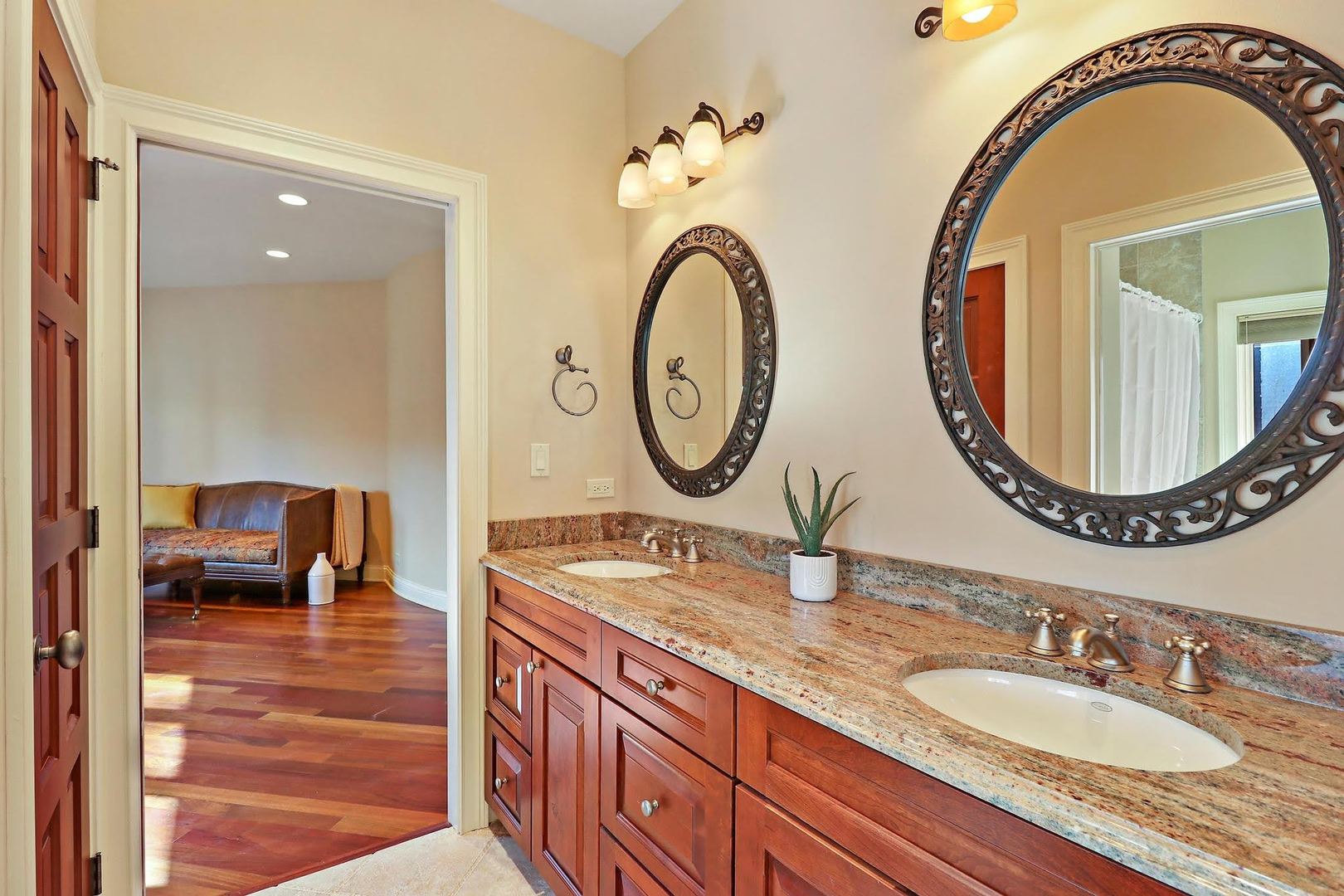 1004 Pistakee View Drive Johnsburg, IL 60051 - Photo 47 of 74 a bathroom with a granite countertop double vanity sink and a mirror