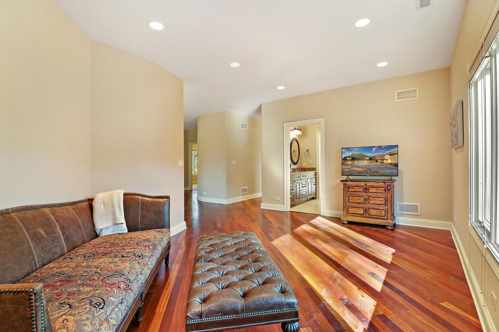 1004 Pistakee View Drive Johnsburg, IL 60051 - Photo 49 of 74 a bedroom with a bed and a couch