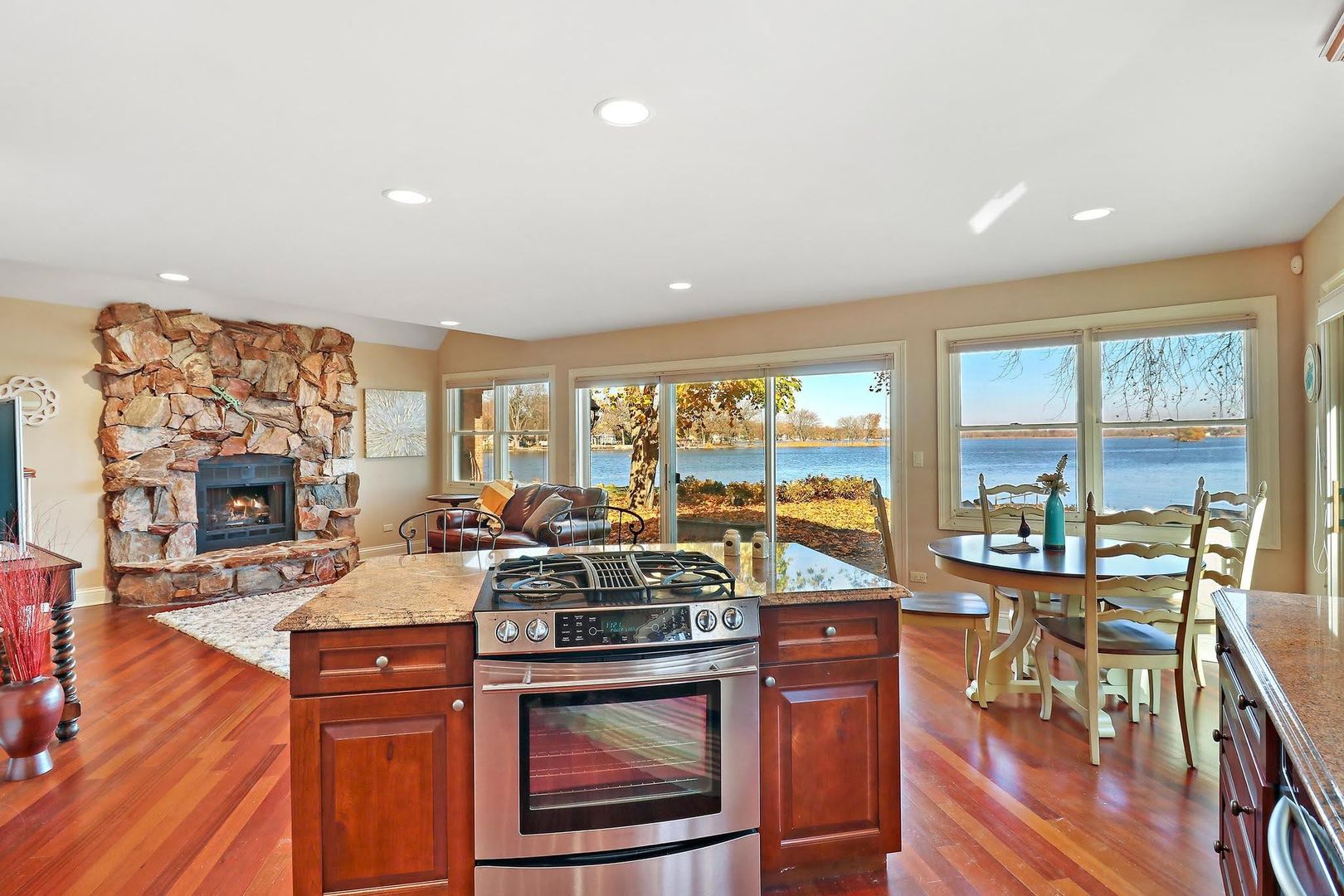 1004 Pistakee View Drive Johnsburg, IL 60051 - Photo 51 of 74 a living room with furniture a fireplace and a floor to ceiling window or wooden floor