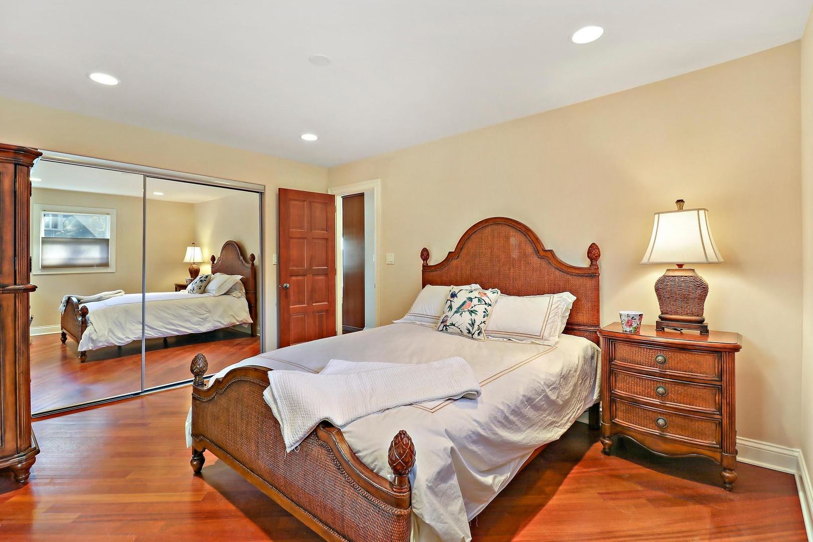 1004 Pistakee View Drive Johnsburg, IL 60051 - Photo 56 of 74 a bedroom with a bed and wooden floor