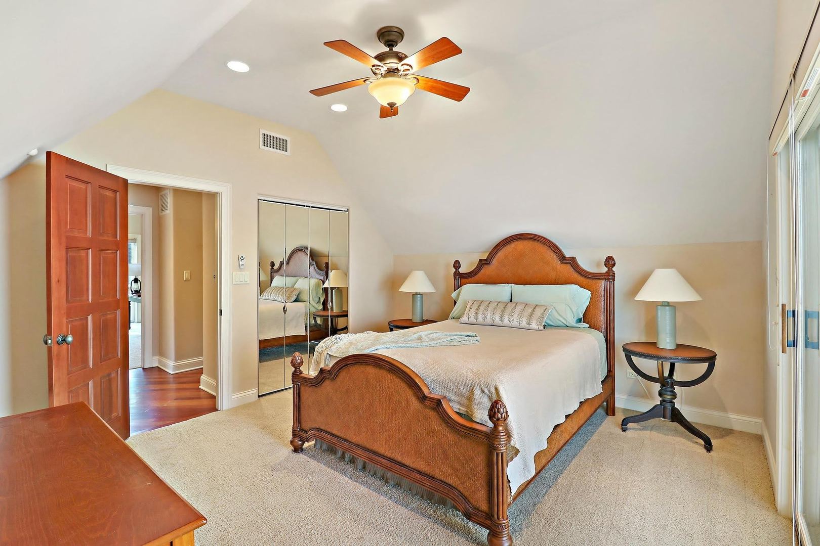 1004 Pistakee View Drive Johnsburg, IL 60051 - Photo 61 of 74 a bedroom with a bed and a chandelier