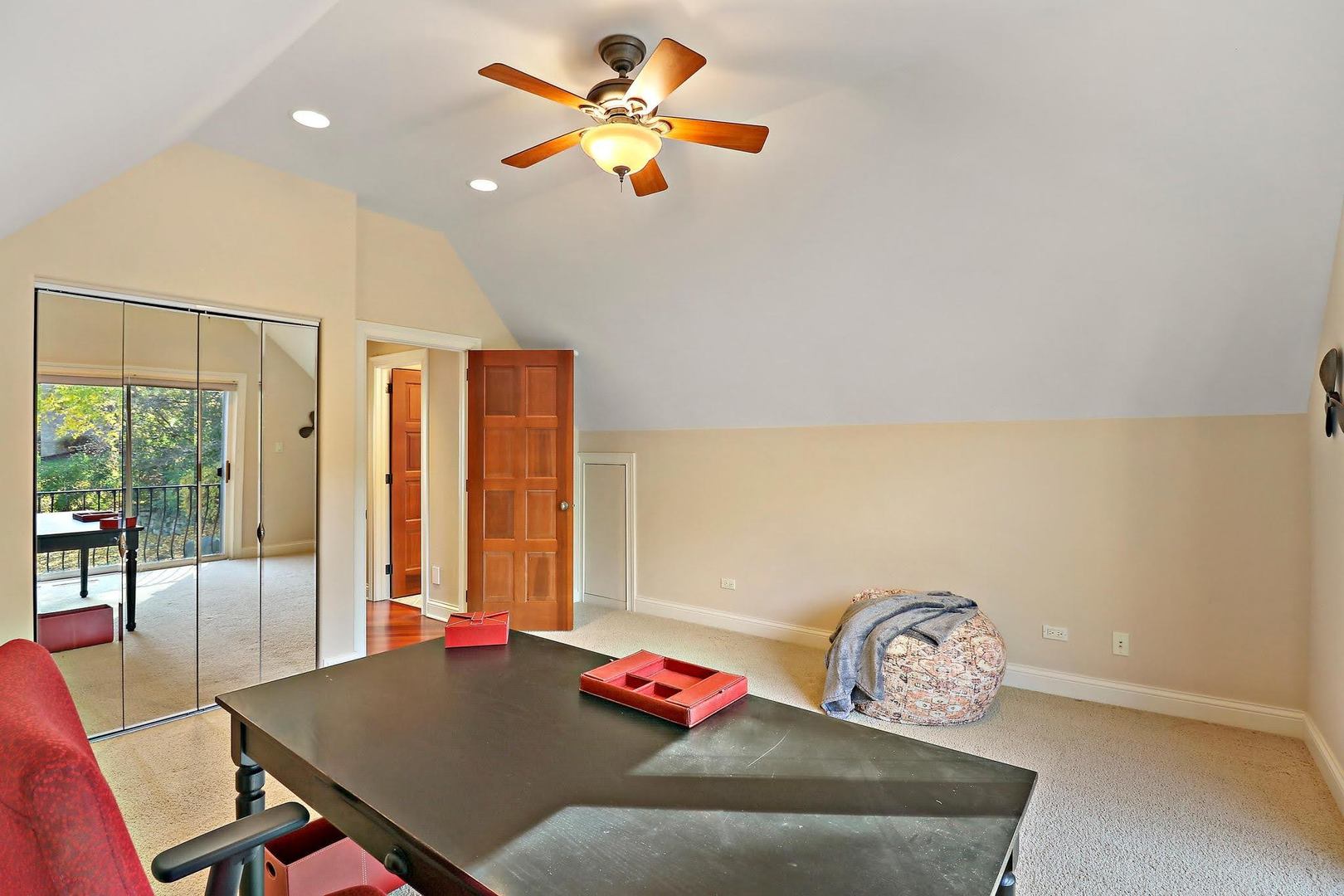 1004 Pistakee View Drive Johnsburg, IL 60051 - Photo 64 of 74 a bedroom with a bed and a table in it