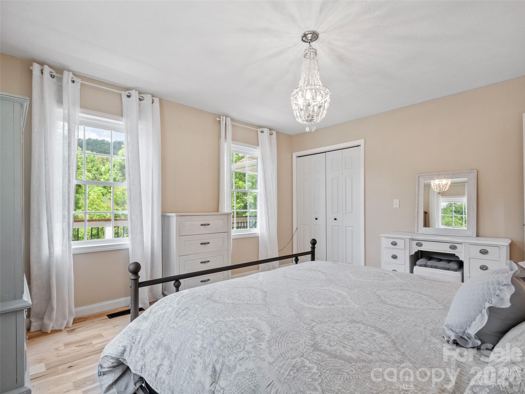 189 Poverty Branch Road Barnardsville, NC 28709 - Photo 20 of 48 a spacious bedroom with a large bed and a window