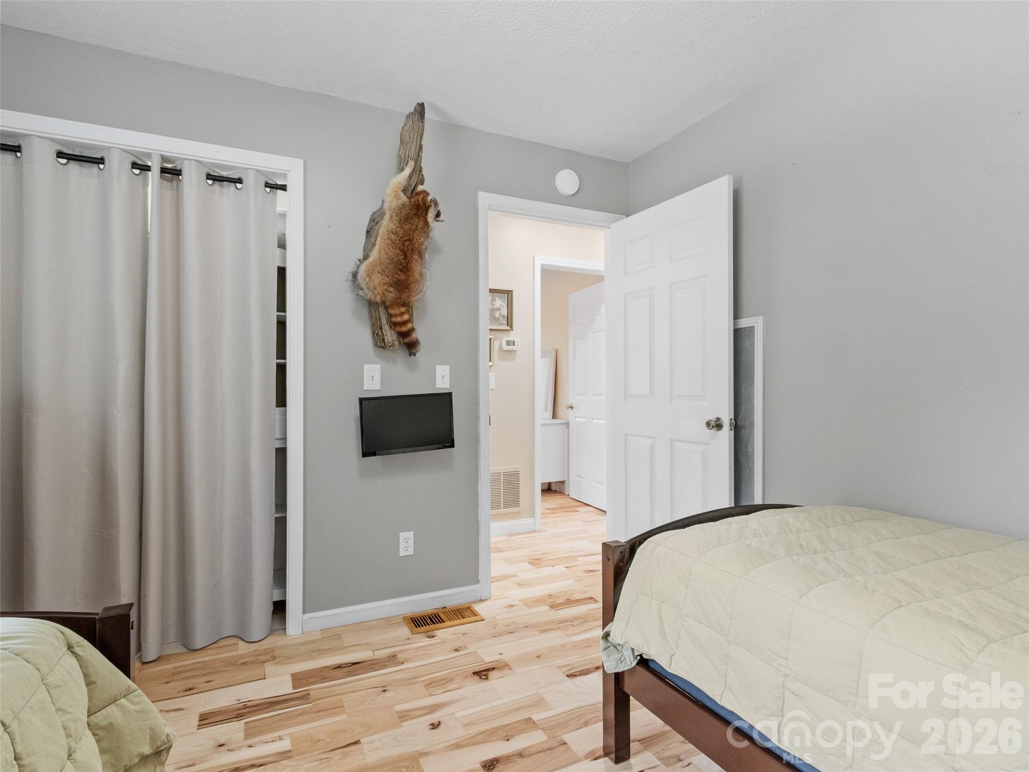 189 Poverty Branch Road Barnardsville, NC 28709 - Photo 25 of 48 a bedroom with a bed and a tv
