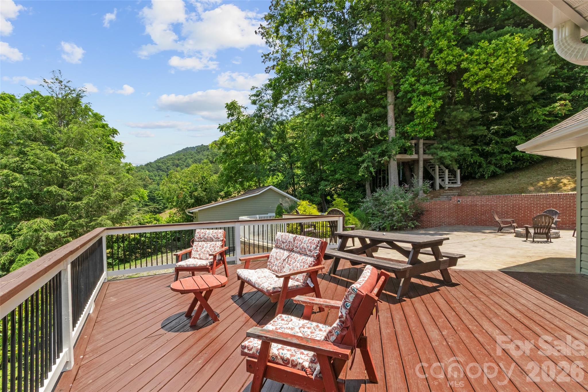 189 Poverty Branch Road Barnardsville, NC 28709 - Photo 42 of 48 a view of a patio with wooden floor and outdoor seating