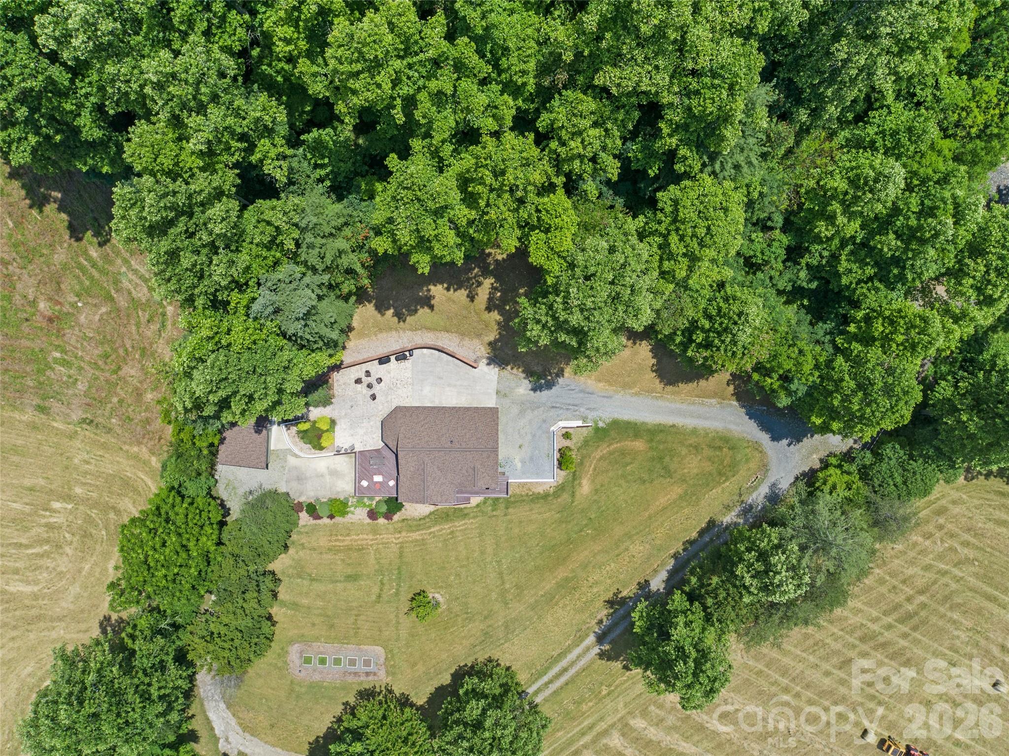 189 Poverty Branch Road Barnardsville, NC 28709 - Photo 44 of 48 an aerial view of a house with a yard and trees all around