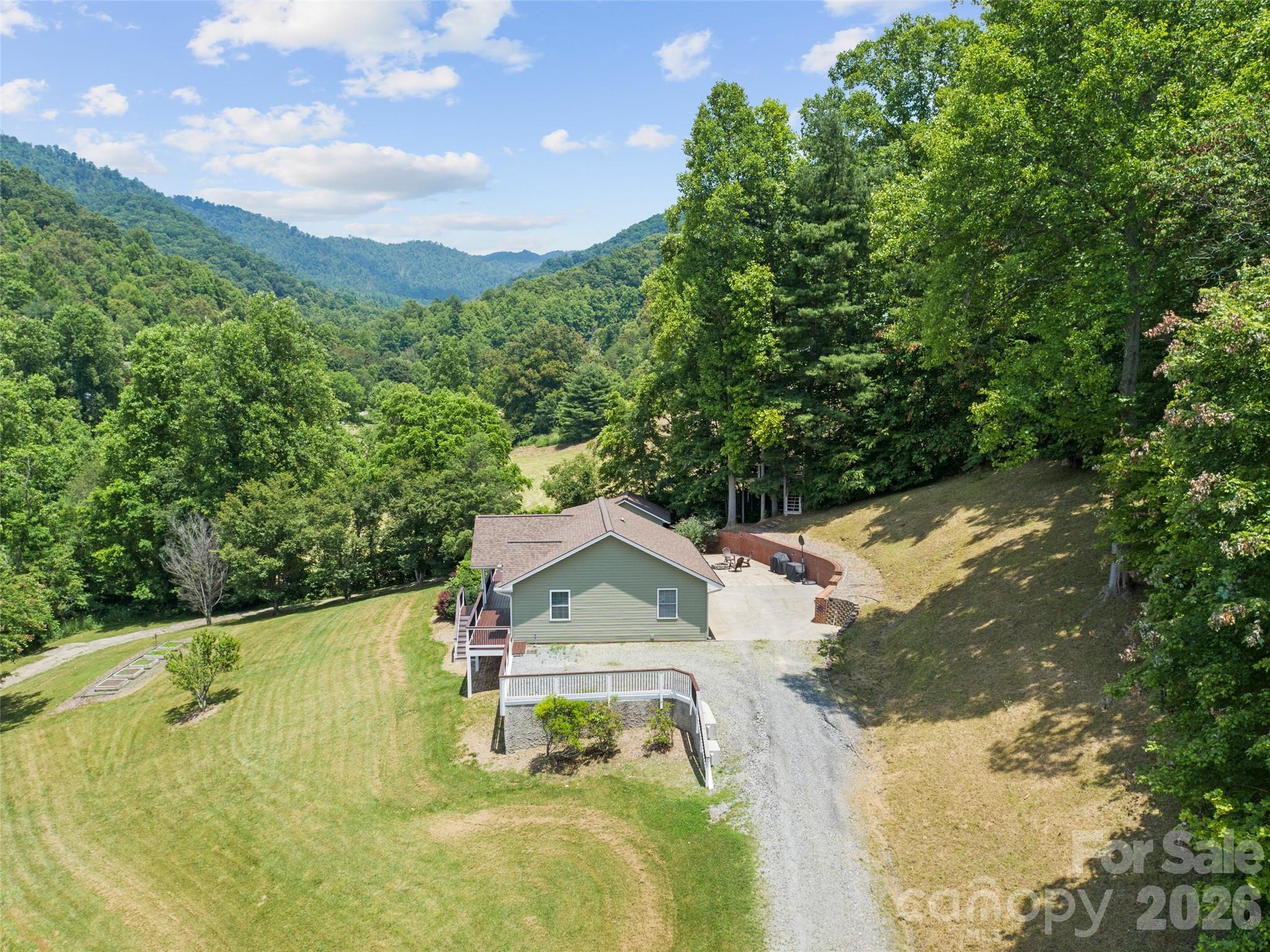 189 Poverty Branch Road Barnardsville, NC 28709 - Photo 45 of 48 a view of a house with a yard