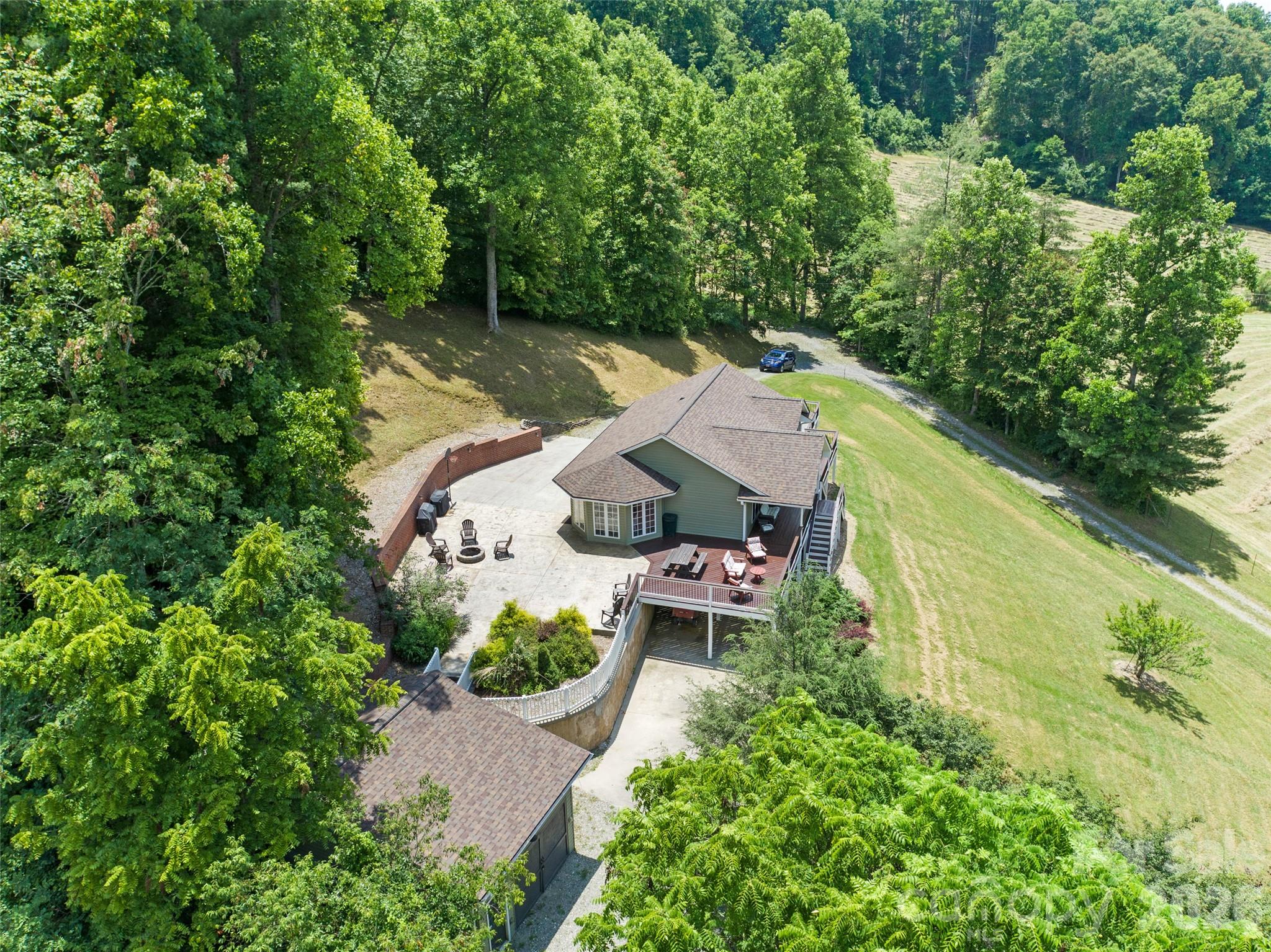 189 Poverty Branch Road Barnardsville, NC 28709 - Photo 46 of 48 an aerial view of a house with outdoor space