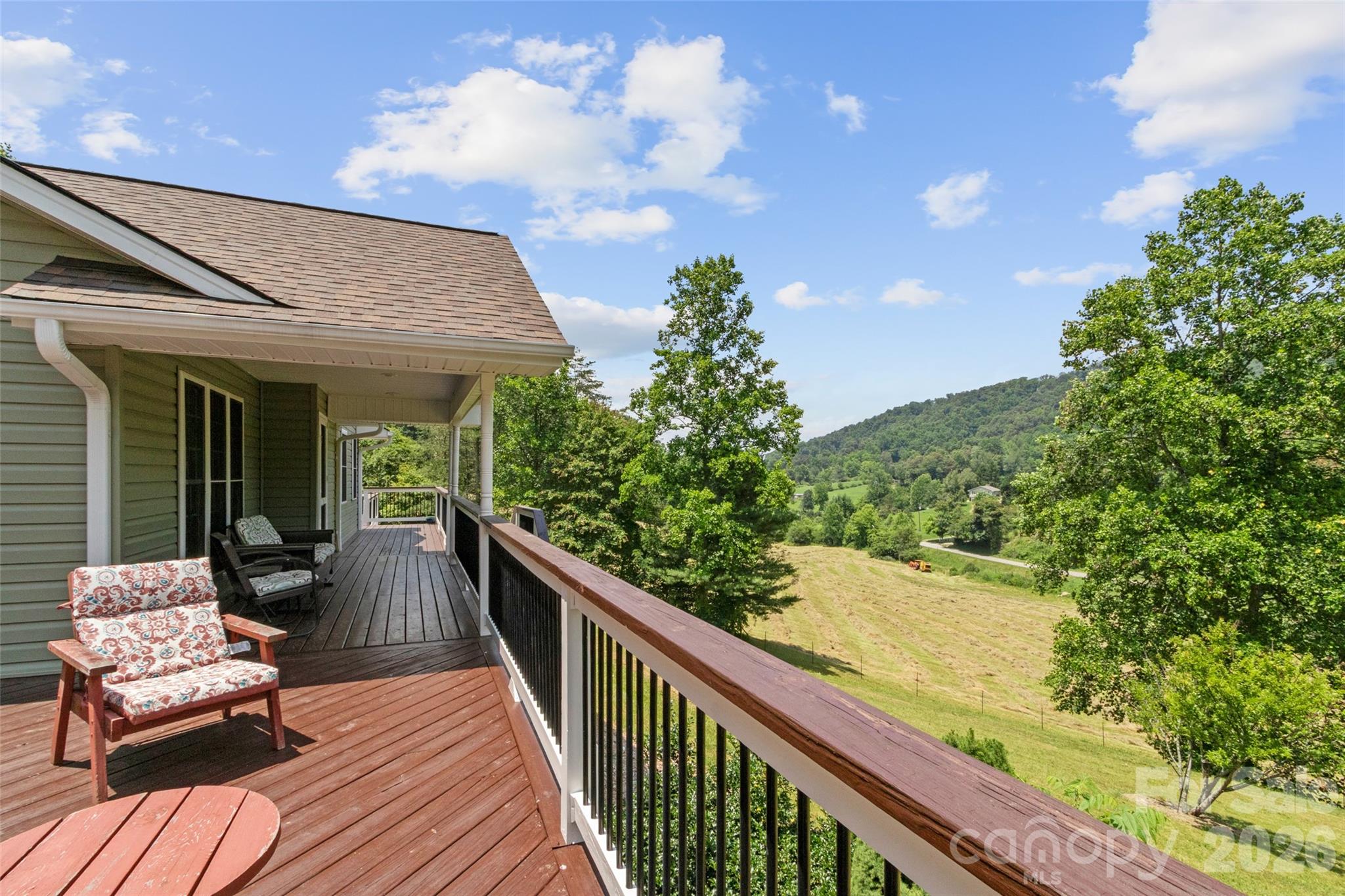 189 Poverty Branch Road Barnardsville, NC 28709 - Photo 6 of 48 a view of a chair and tables front of the house