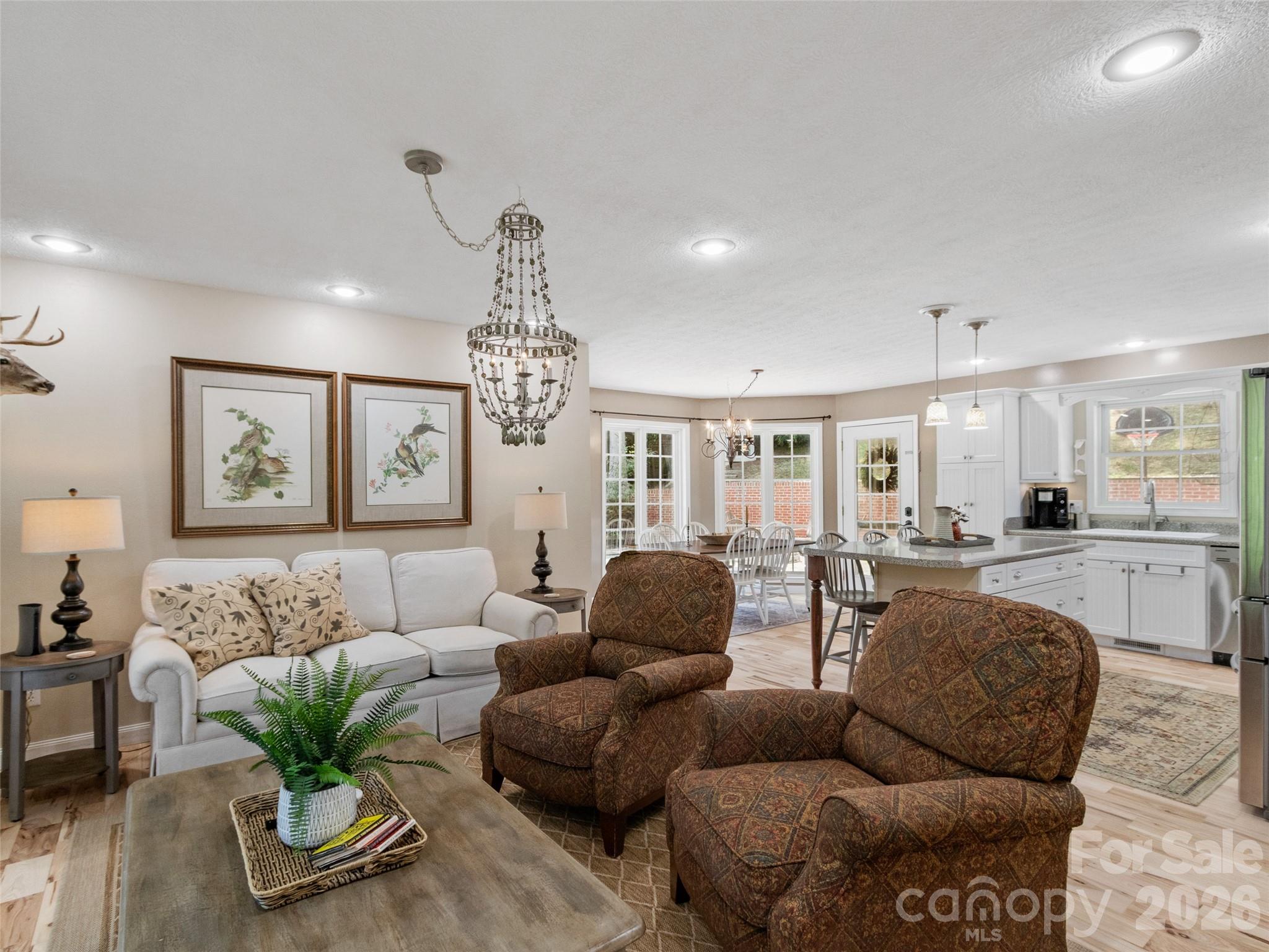 189 Poverty Branch Road Barnardsville, NC 28709 - Photo 7 of 48 a living room with furniture and a chandelier
