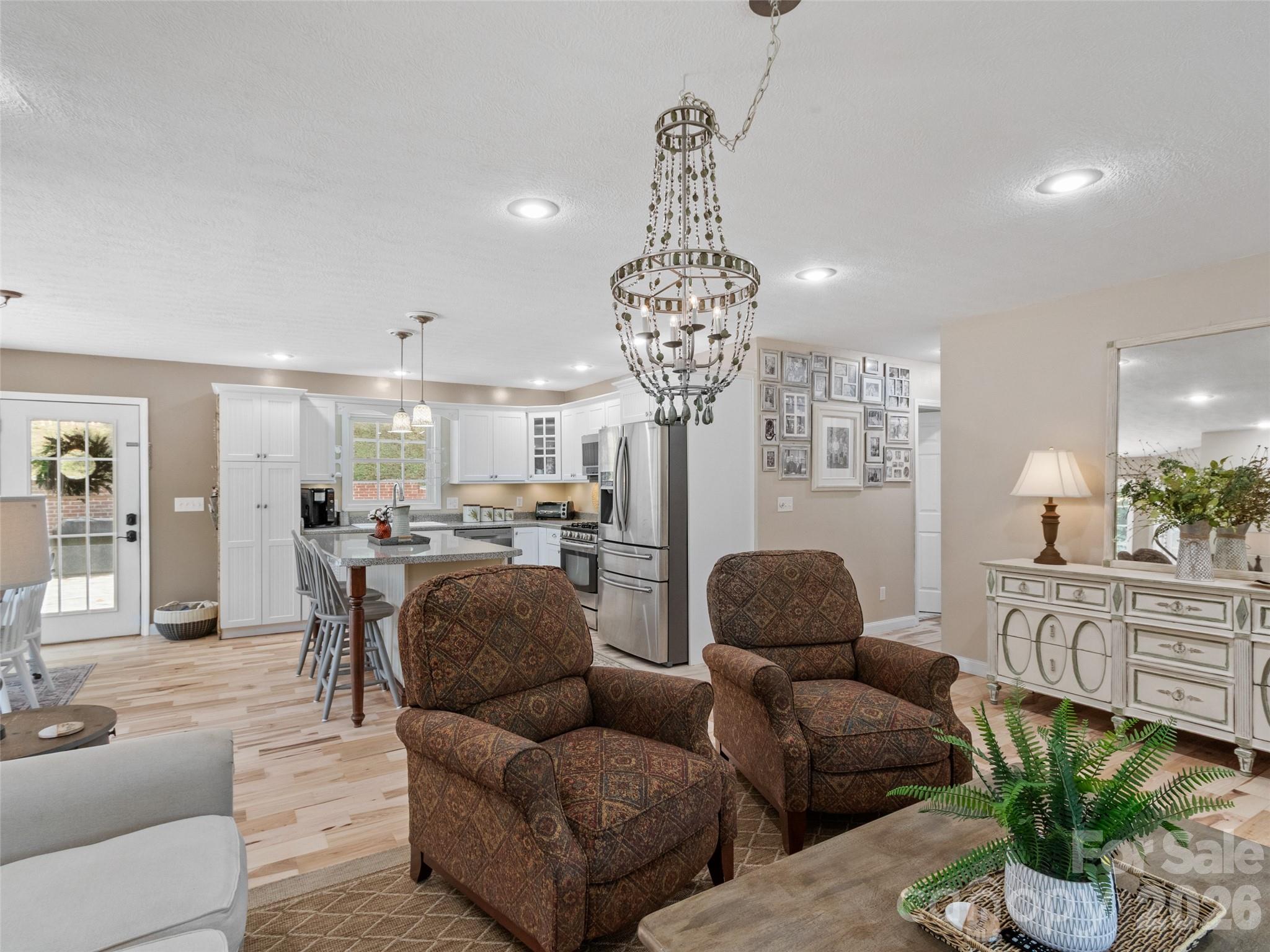 189 Poverty Branch Road Barnardsville, NC 28709 - Photo 8 of 48 a living room with furniture and a chandelier
