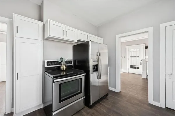 a kitchen with cabinets and stainless steel appliances