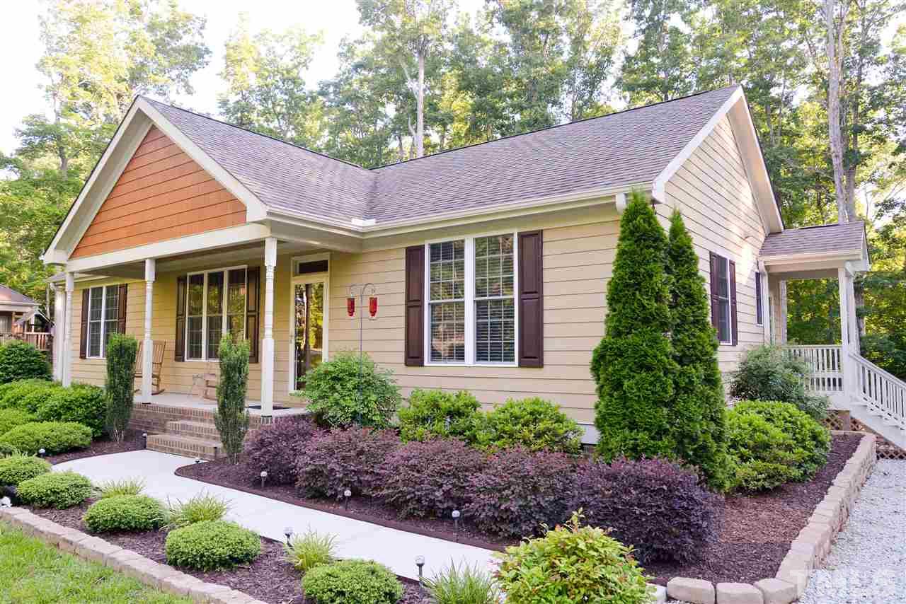 201 Weaver Ridge Road Rougemont, NC 27572 - Photo 1 of 25 a view of a house with a yard