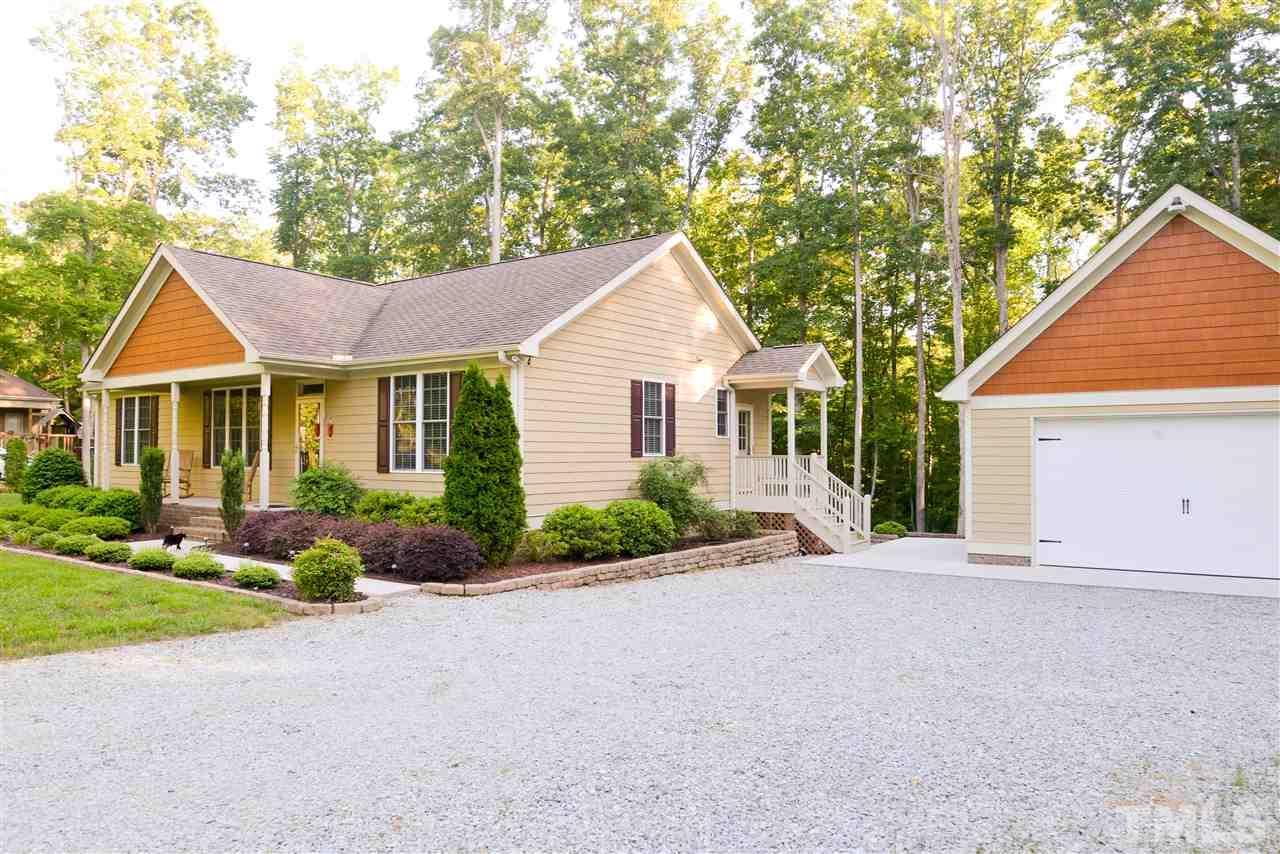201 Weaver Ridge Road Rougemont, NC 27572 - Photo 3 of 25 a front view of a house with garden