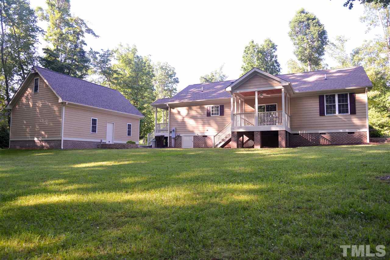 201 Weaver Ridge Road Rougemont, NC 27572 - Photo 23 of 25 a front view of a house with a garden
